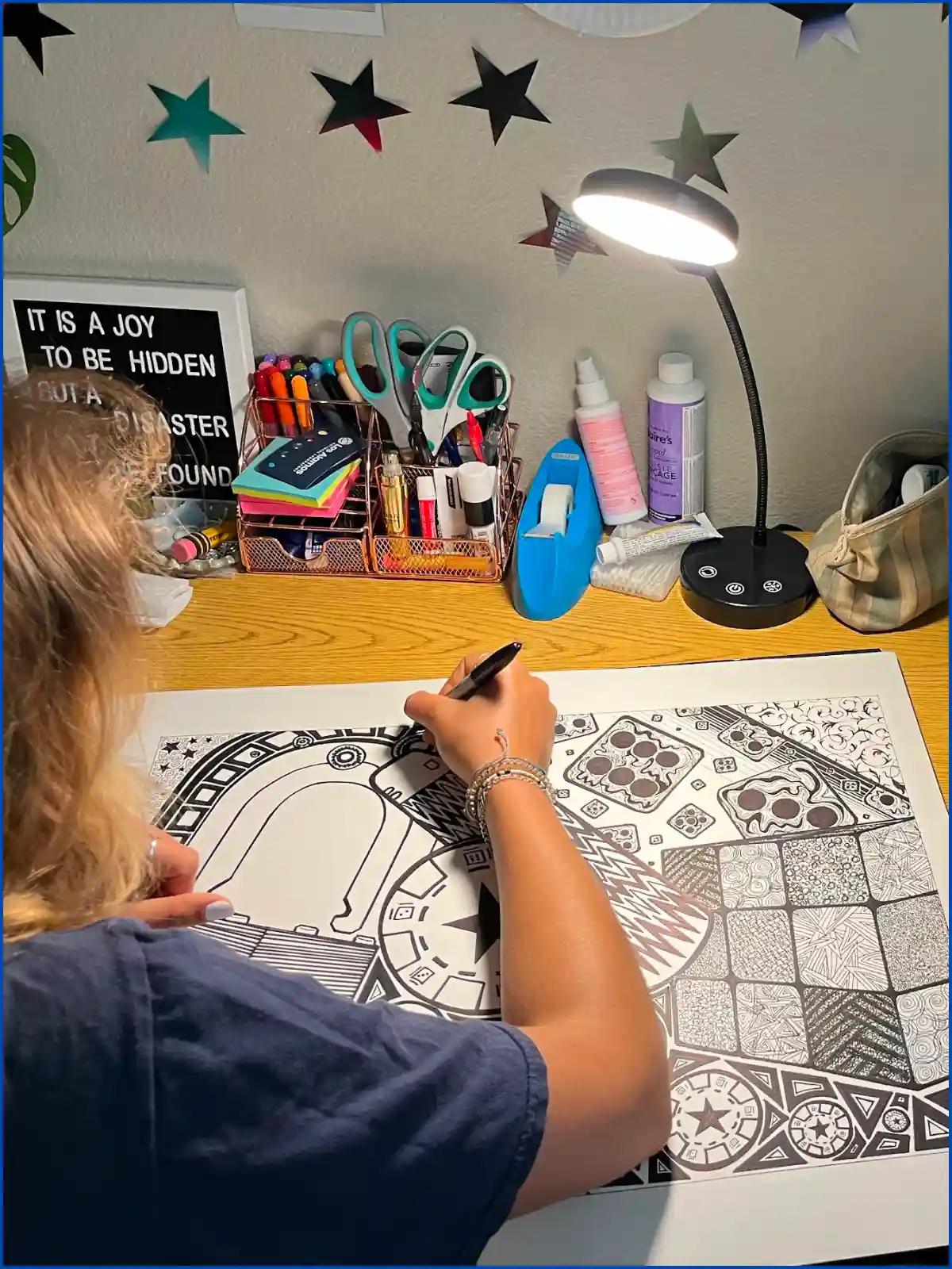 Adelina drawing at desk